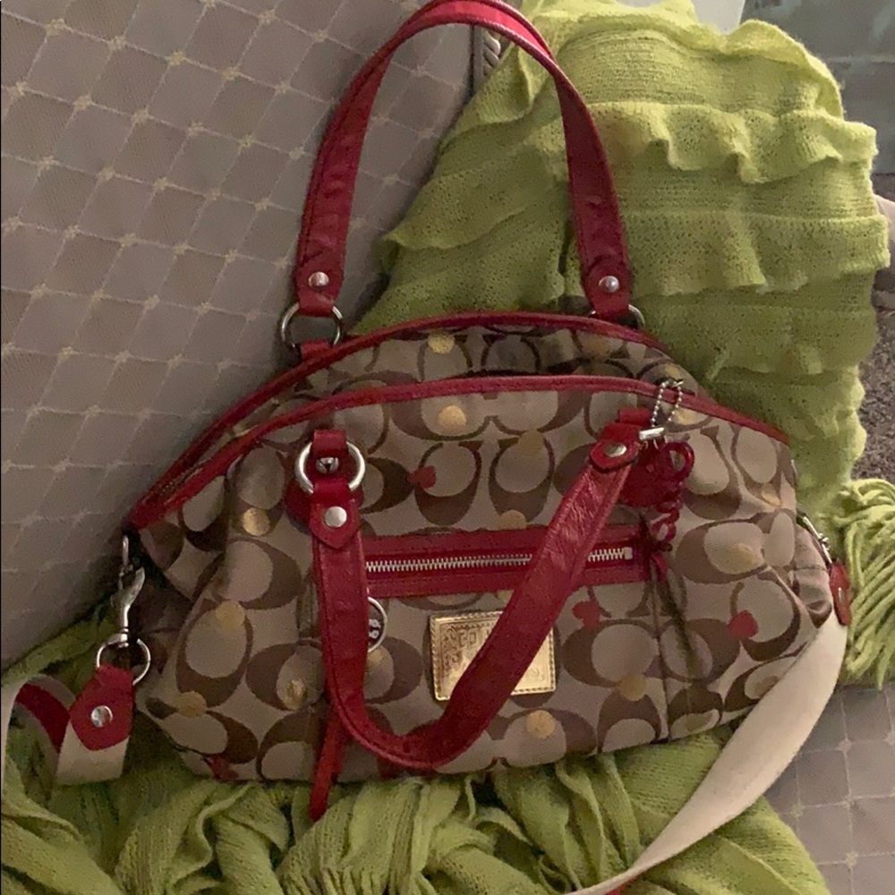 Tan coach purse with red hearts and gold circles
